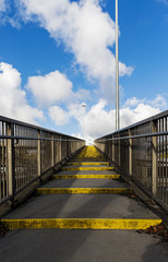 Urban walkway against blue sky with cloud