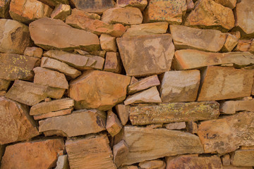 muro de piedra y roca antiguo de color naranja