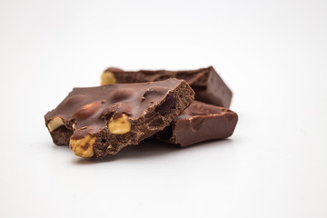 Chocolate pieces on white background