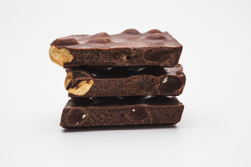 Chocolate pieces on white background
