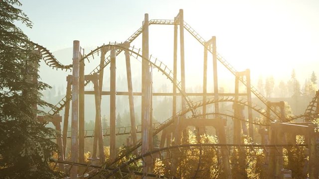 old roller coaster at sunset in forest