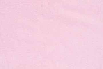 Texture of pink knitted silk sweater background