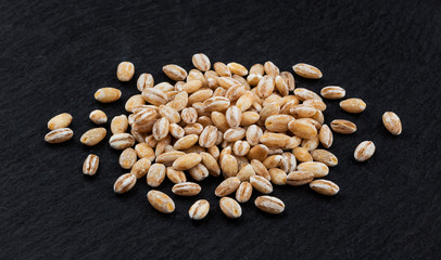Pearl barley on black background