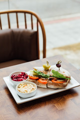 Grilled chicken sandwich made with homemade bread, tomato and lettuce served with beetroot salad and coleslaw.