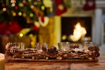 Christmas still life with candle and fireplace