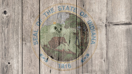 USA Politics News Concept: US State Indiana Seal Wooden Fence Background