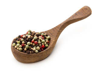 Pepper mix seed on spoon on white background.