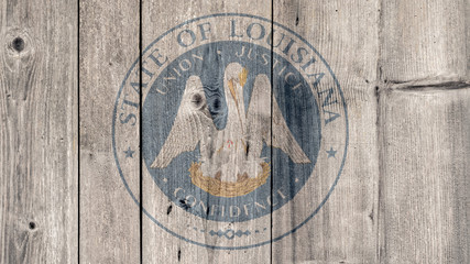 USA Politics News Concept: US State Louisiana Seal Wooden Fence Background