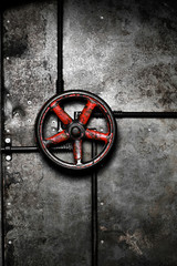 The red valve on the door.