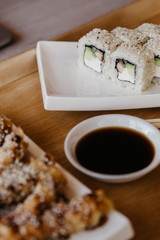 Philadelphia roll sushi cucumber, avocado, cream cheese, red caviar. Sushi menu
