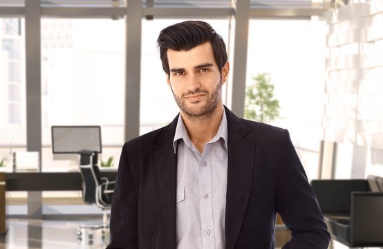 Goodlooking young businessman at office