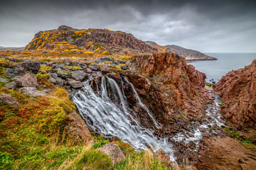 Waterfall in Teriberka in autumn