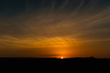 sunrise of black desert near Merzouga, Morocco