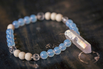 Opalite beads bracelet with crystal quartz in natural shape