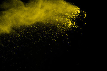 Gold powder particles explosion. Glitter burst with golden texture. Yellow color dust splash for fashion background.