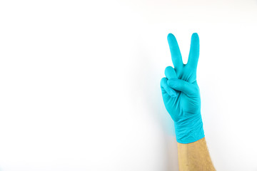 Male hand in medical glove on white background.