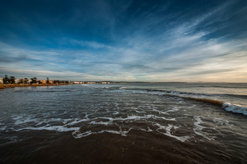 Beach looking towards the port and old town, Essaouira, Morocco, North Africa