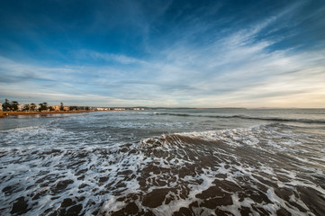 Beach looking towards the port and old town, Essaouira, Morocco, North Africa