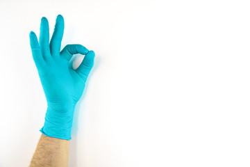 Male hand in medical glove on white background.