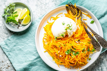 Butternut squash noodles with mozzarela, pecans, herbs, copy space