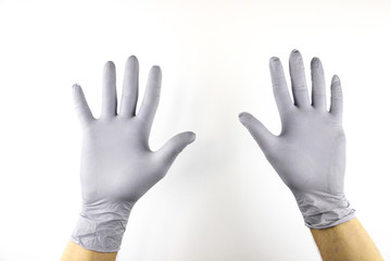 Male hand in medical glove on white background.