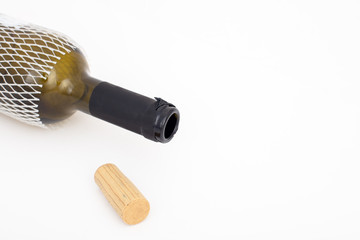 Empty red wine bottle  and cork  isolated on white background