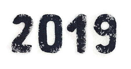 The Christmas, New Year from denim, is covered snow   form of inscriptions, 2019 numbers, isolated on white.