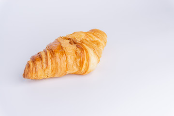Plain croissant on white background
