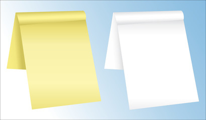White and yellow notepads with blank pages