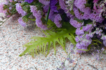 purple flower on desk 