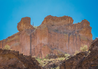 Fototapeta na wymiar Arizona desert wilderness sheer rocky cliffs surround a man made lake in Arizona's wilderness area