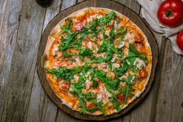 Pizza with arugula and shrimp
