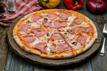 Pizza with ham and mushrooms