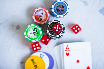 Poker set: plastic playing cards and poker chips in the metal case. Social advertisement, gaming addiction, gambling business, earning methods, entertainment and lifestyle concept. 