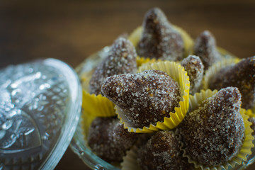 delicious Brazilian sweets called cajuzinho - blend of condensed milk with peanuts and chocolate