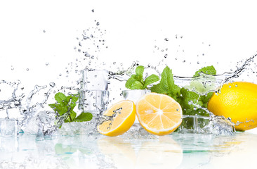 ice cubes and splashing water with mint and lemon on a white background...