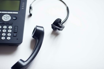 Deskphone, office and business concept. New ip phone with buttons and big display for communication without interference. Top view. Space for a text. Close up.