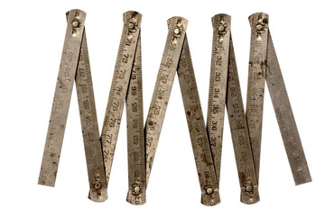 Old metal rusty folding ruler as used by carpenter.  Isolated on white