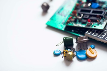 Microprocessor concept. Set of drivers, diodes, capacitors, inductance and other micro electronics on the white background. Top view. Space for a text. Close up.