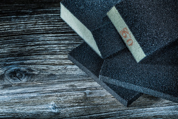 Set of polishing abrasive sponges on vintage wooden board