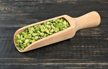 Dry green peas in scoop