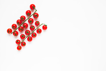 Cherry tomatoes isolated on white. Food, diet, cooking, vegetables, vegan concept. Top view. Close up.