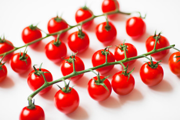Cherry tomatoes isolated on white. Food, diet, cooking, vegetables, vegan concept. Top view. Close up.