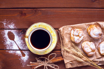 Beautiful set of bakery products and vintage cup of tea. Flat lay composition of breakfast food on the wooden background. Food, break, cooking, lifestyle concept. Top view. Close up.