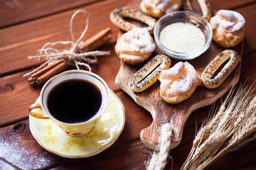 Beautiful set of bakery products and vintage cup of tea. Flat lay composition of breakfast food on the wooden background. Food, break, cooking, lifestyle concept. Top view. Close up.