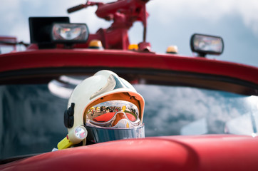 Low angle close-up of a shiny reflecting firefighter's helmet.