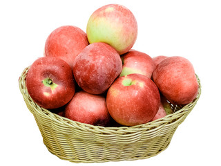 Ripe red apple in wicker basket isolated on white