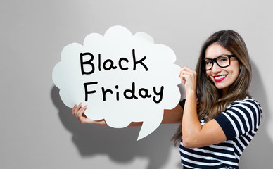 Black Friday text with young woman holding a speech bubble