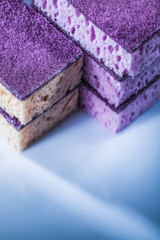 Pile of kitchen sponges on white background