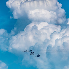 Military fighters fly in formation